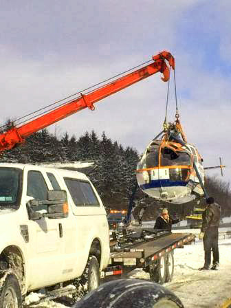 A wrecked helicopter was recovered in Upstate New York after the truck carrying the bird overturned. / Photo courtesy of NYSP