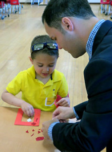  Incoming Sloatsburg Principal Joe Lloyd gave Ryan a hand with at a recent SES kindergarten orientation activity.