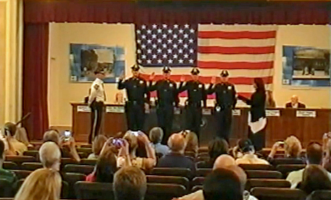 Suffern Mayor Trish Abato (far right) swears in new Suffern police officers at a September Village Board meeting. 