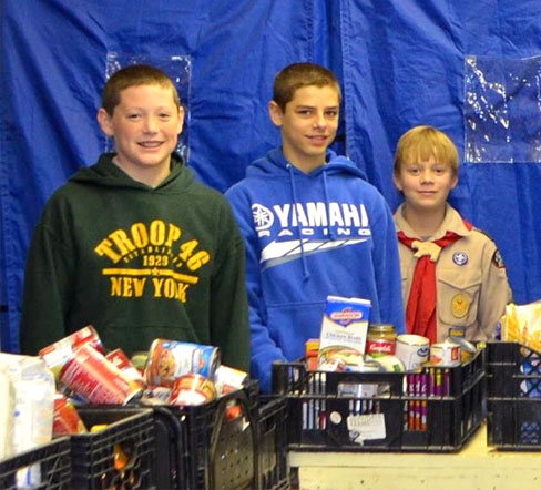 Helpful Boy Scouts from Troop 2146 sorting food at the Sloatsburg UMC Food Pantry.