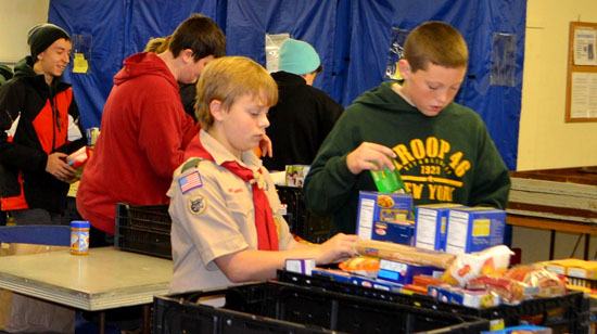 Scouts from Troop 2146  that serves Sloatsburg and Tuxedo sort food from a food drive that collected some 700 pounds for those in need.