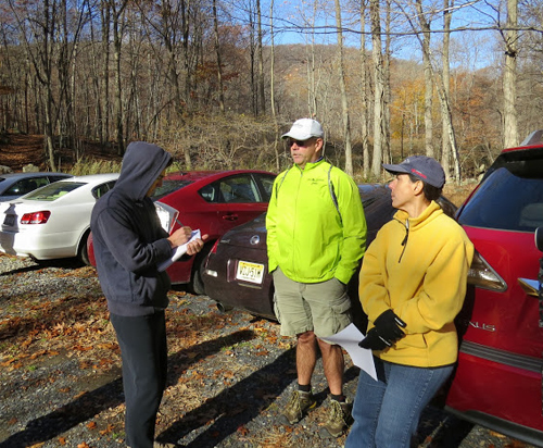 Ramapo College student Lucas Slott interviews hikers about their position on the proposed Genting Casino / Photo by Geoff Welch