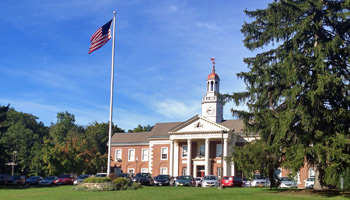 Tuxedo residents vote Tuesday for the town's school budget and for three Board of Education seats, where 5 of the 8 candidates have discussed closing George F. Baker High School.