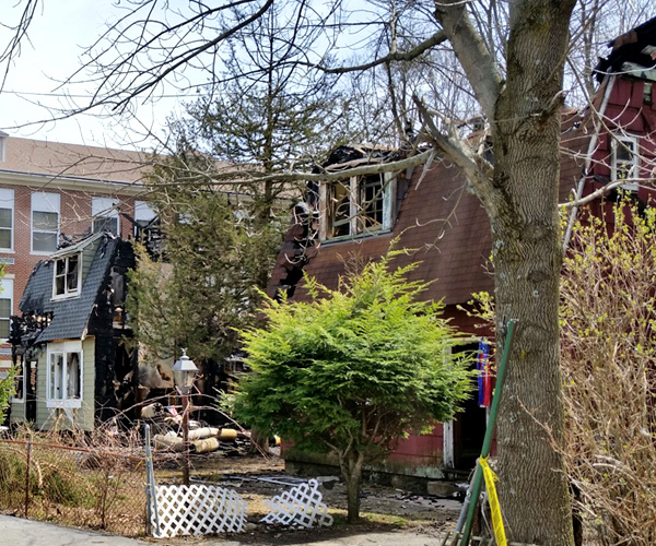 Two homes on Schoolhouse Road next to George F. Baker High School in Tuxedo were gutted in an early Sunday morning fire, leaving two families displaced. The Town of Tuxedo has started a community drive to help both families. Photo courtesy of William A. Sweet