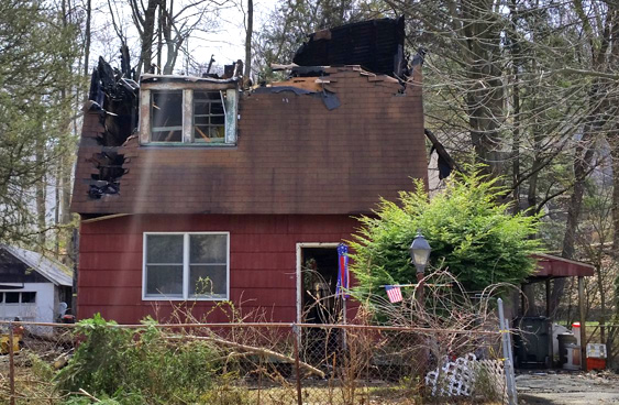 House along Schoolhouse Drive in Tuxedo that caught fire after a fire from a late-night fire at a neighboring house. / Photo courtesy of Wiliam A. Sweet