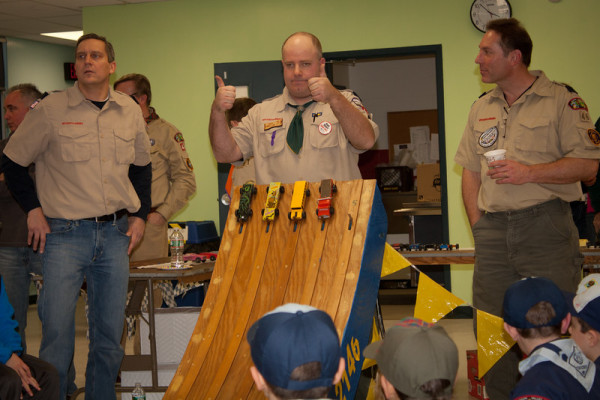 Local Pack leader Brian Colton gives the thumbs up at this year's Pine Wood Derby. / Photo courtesy Cub Scout Pack 46