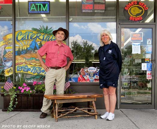 Dr. Chuck Stead and Lauren Hayward in front of Hayward's Deli in Sloatsburg -- Stead won First Prize in Hayward's summer raffle to raise funds for the Sloatsburg Food Pantry. Local native wood furniture maker Mark Nimel donated the raffle prize.
