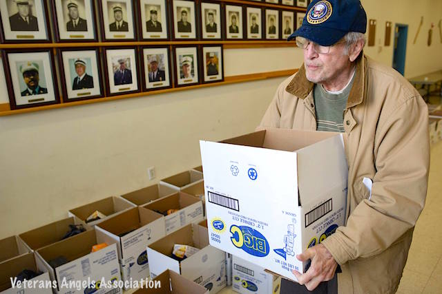 Sloatsburg Historian and Veteran Harrison Bush carries off a box of goodness during Sloatsburg's Thanksgiving veteran food effort.