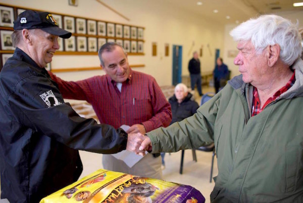 Sloatsburg Mayor Carl Wright (middle) greets Richard Jarcho (right) and a local veteran at one of the recent Sloatsburg Veteran Food Baskets.