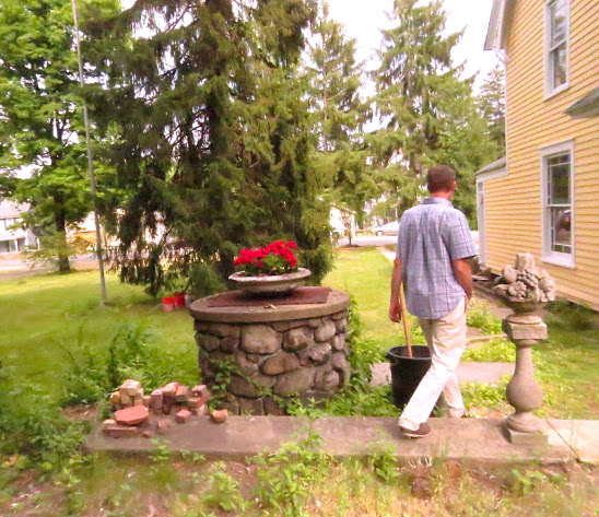 Ed Marse walks near the well