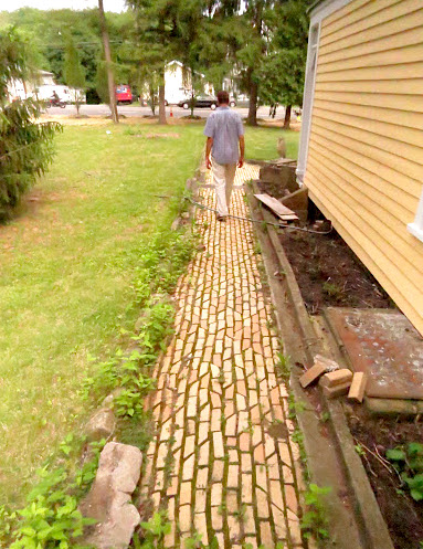 Ed Marse continues along the McCready property's 100 year plus yellow brick walkway
